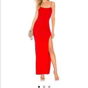 Red strappy floor length dress with thigh high knee slit